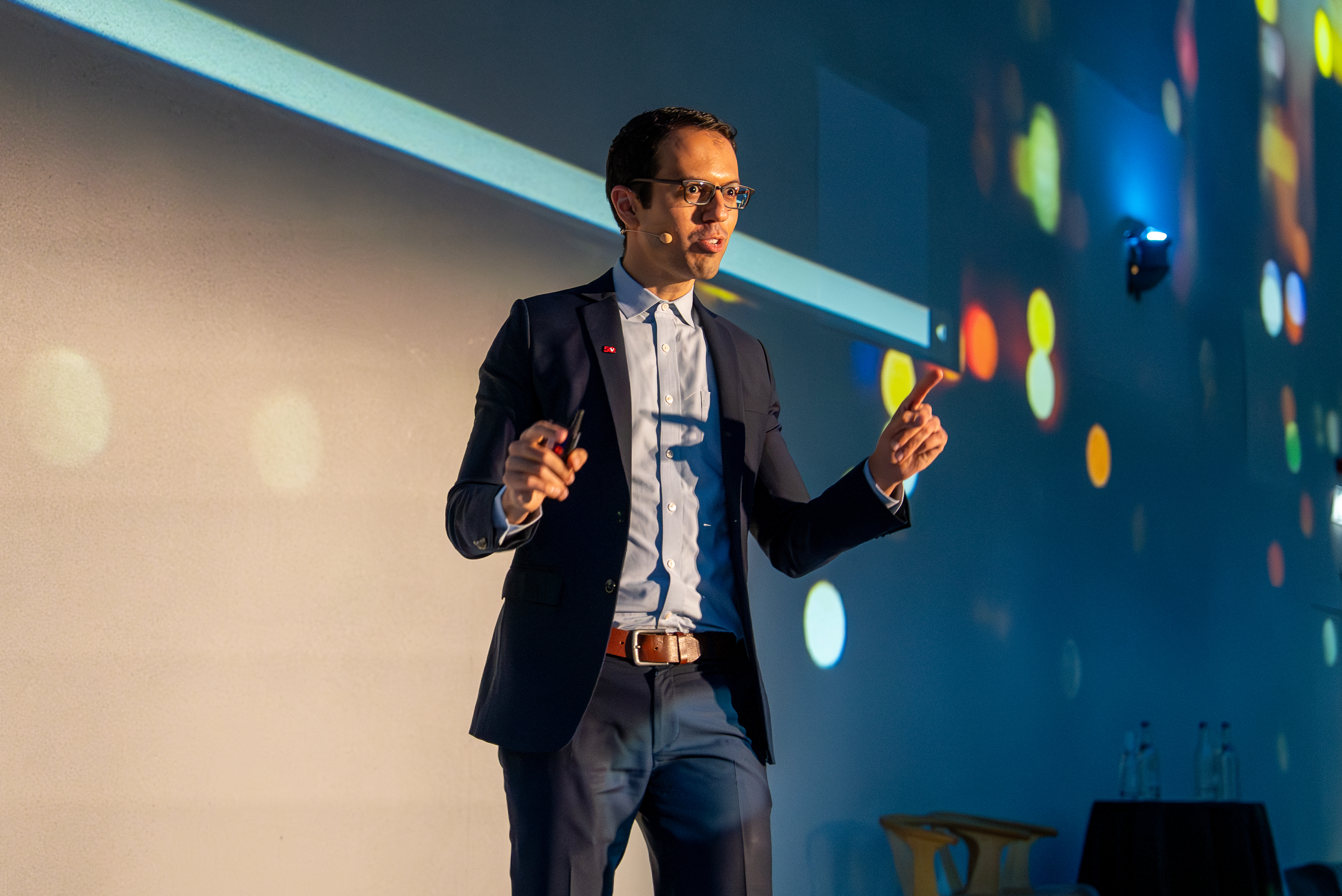 Paul Costa talking on stage