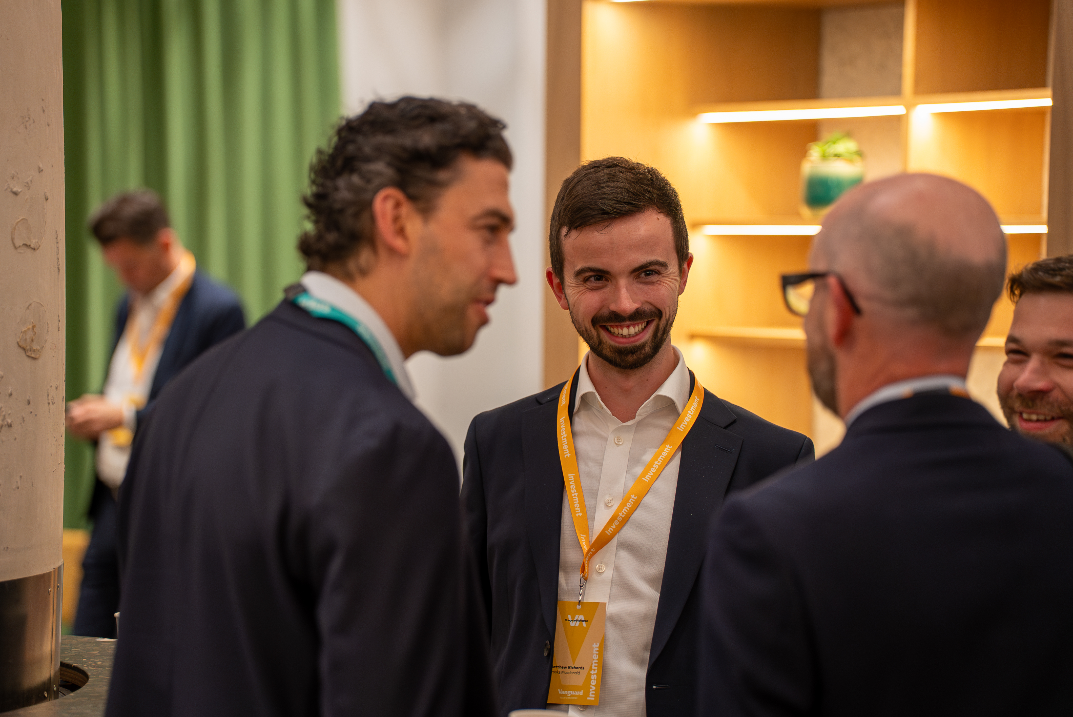 Matt Haigh talking with conference attendees during a break