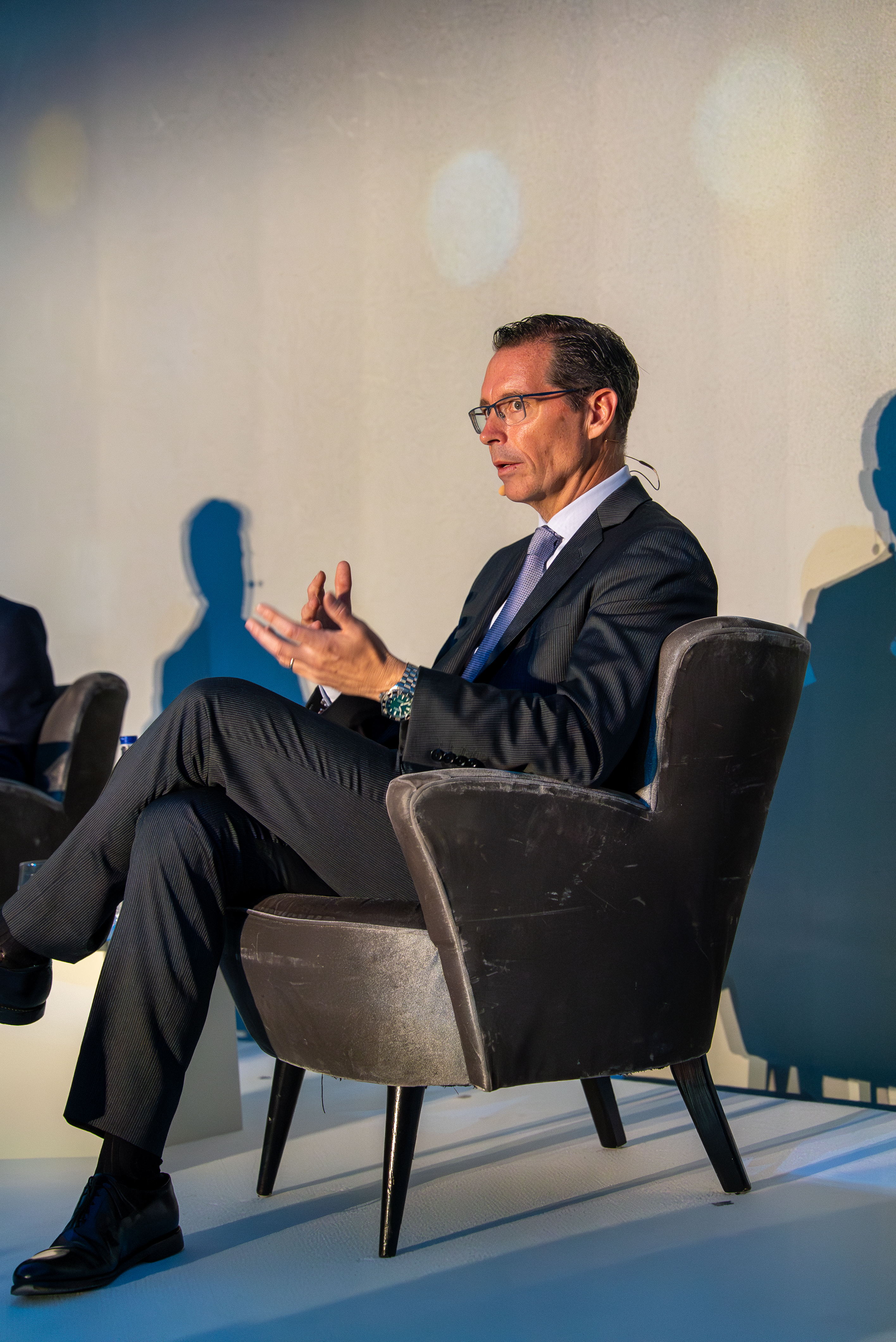 Joe Davis sitting on stage at Vanguard Advance