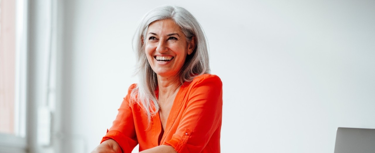 Woman in an orange top